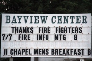 Signs like these greet firefighters and residents driving through Bayview. Photo by Ben Olson.