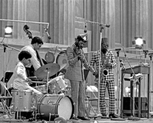 L to R: Denardo Coleman, Charlie Haden, Coleman and Dewey Redman, Hearst Greek Amphitheatre. Photo by Lee Santa.