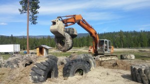 A dozer positions some of the repurposed tires. Photo courtesy Mountain Mafia Entertainment.