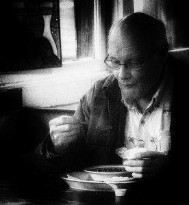 A man enjoys a meal at Monday's soup kitchen at the Hoot Owl Cafe. Photo by William G. Rosch.