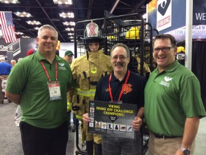 Ken Baker, a captain with the Bonners Ferry Fire Dept. accepts an award for over $50k worth of gear for winning the “Viking Shake Off Challenge.” Photo courtesy of Viking Turnout Gear Facebook page.