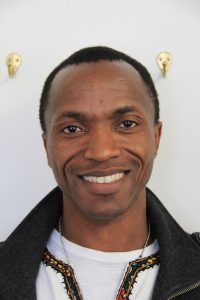 Come Nzibarega came from the US from Burundi. He speaks five languages and is currently working as a French teacher at NW Christian School in Spokane. Photo by Ben Olson.